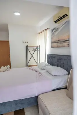 two beds sitting next to each other in a bedroom at Beach Center in Ulcinj