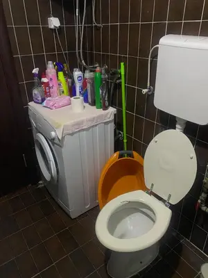 a bathroom with a toilet and a trash can at Darkobd in Budva