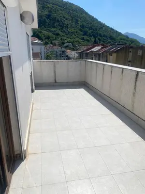 a balcony with a view of a mountain at Darkobd in Budva