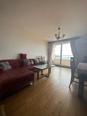 a living room with a couch and a table at Apartment Sea Point in Becici