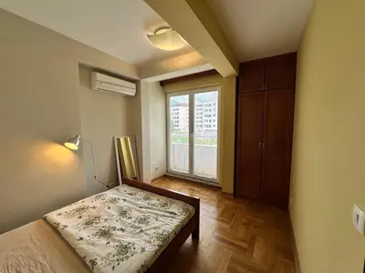 a small bedroom with a bed and a window at Apartment Sea Point in Becici