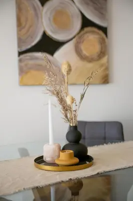 a table with a candle and a hat on it at The Royal Summer & Spa in Becici