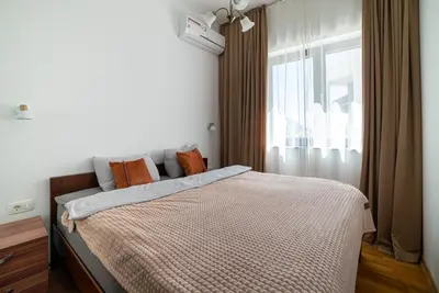 a bedroom with a large bed with a window at The Royal Summer & Spa in Becici