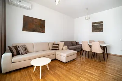 a living room with a couch and a table at The Royal Summer & Spa in Becici
