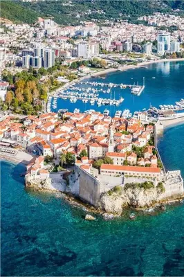 an aerial view of a city with boats in the water at Apartment Gala in Budva