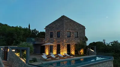 a house with a swimming pool next to a building at Villa Diamonte in Ðuraševići