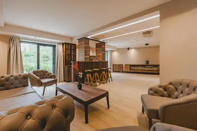 a living room with a couch and a table at Villa Diamonte in Ðuraševići