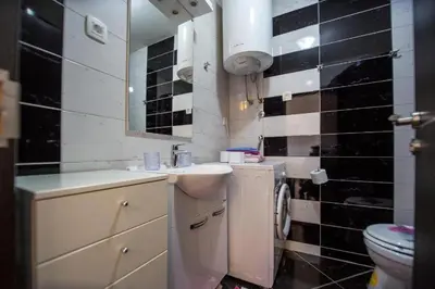 a bathroom with a sink and a toilet at Apartmans Budva centar in Budva