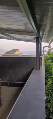 a view of the ocean from the roof of a house at Apartment Cataleya in Budva