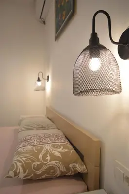 a room with a bed with a lamp and a pillow at Apartment Folic Sutomore in Sutomore