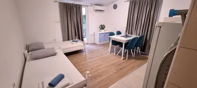 a small living room with a couch and a table at Apartment Folic Sutomore in Sutomore