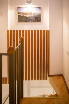 a staircase in a room with a striped wall at Azur Apartment in Budva