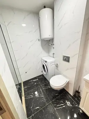 a bathroom with a toilet and a sink at Becici Garden in Becici