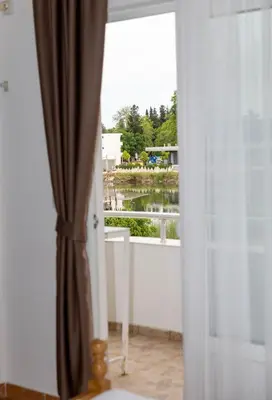 a view of a balcony from a room with a window at Villa Duraku in Ulcinj
