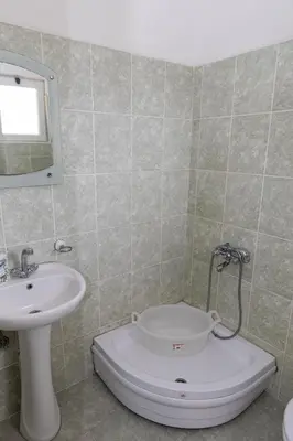 a bathroom with a toilet and a sink at Villa Duraku in Ulcinj