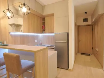 a kitchen with a counter and a refrigerator at Studio Jelena in Budva