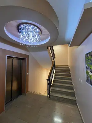 a hallway with a ceiling with a chandelier at DOWNTOWN apartment Old Town in Podgorica