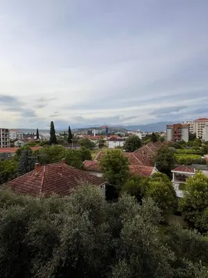a view of a city with buildings and trees at DOWNTOWN apartment Old Town in Podgorica