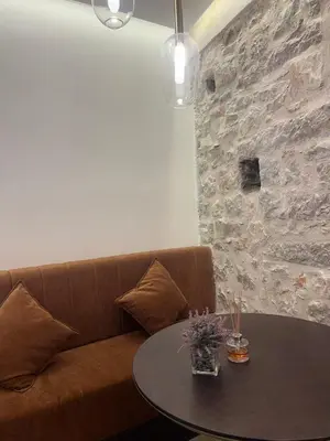 a living room with a couch and a table at Casa Del Sol Pietra Kotor in Kotor