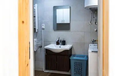 a bathroom with a sink and a mirror at Green Garden in Tivat