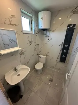 a bathroom with a sink and a toilet at Villa Paris in Donji Štoj