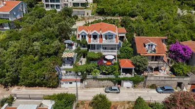 an overhead view of a large house in a city at Apartmani Elena in Bigovo