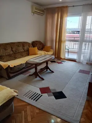 a living room with a couch and a rug at Apartman centar Bar in Svijetin Brijeg