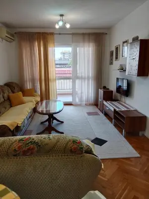 a living room with a couch and a table at Apartman centar Bar in Svijetin Brijeg