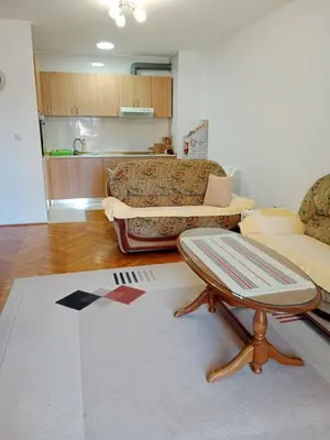 a living room with a couch and a coffee table at Apartman centar Bar in Svijetin Brijeg