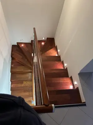 a staircase in a house with wooden floors at Vista Apartment in Kotor