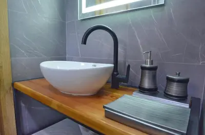 a bathroom with a sink and a faucet at Apartments Spasoje 1 in Dobrota