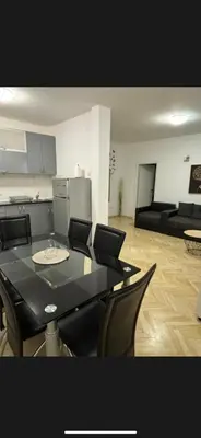 a living room with a black table and chairs at Citadela Old Town Budva in Budva