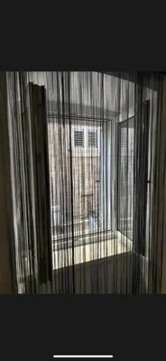 a view of a window with curtains in a room at Citadela Old Town Budva in Budva