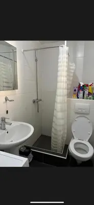 a bathroom with a shower with a toilet and a sink at Citadela Old Town Budva in Budva