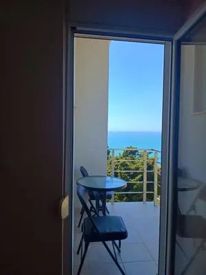 a balcony with a table and a view of the ocean at Jasmin 1 in Ulcinj