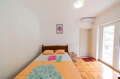 a bedroom with a bed in a room at King`s Heaven Apartments in Budva