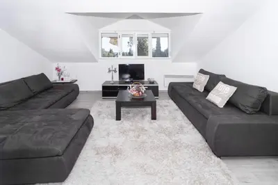 a living room with a couch and a coffee table at Central comfy apartment in Budva