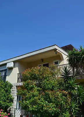a building with trees in front of it at Lovely 1BR Apartment 5min of walk from city center in Bar