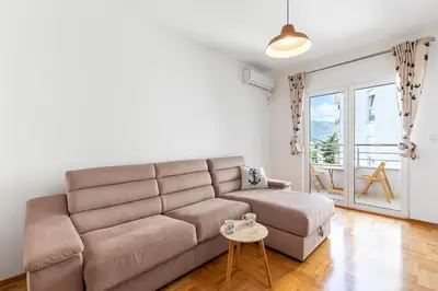 a living room with a couch and a table at Budva Olive Escape in Budva