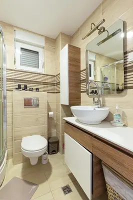 a bathroom with a toilet and a sink at Budva Olive Escape in Budva