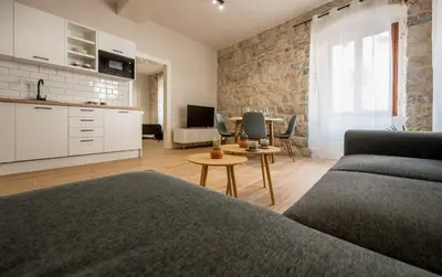 a living room with a couch and a table at Modern Design Old Town Apartment by MN Property in Kotor