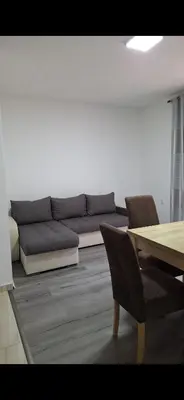 a living room with a couch and a table at Apartmani Madžgalj Sutomore in Sutomore
