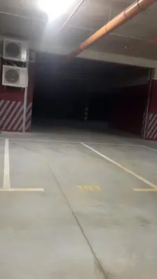an empty parking lot in a parking garage at BrandNew Apartment in Podgorica