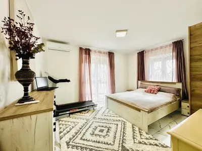 a bedroom with a bed and a large window at MorePlanina in Sutomore