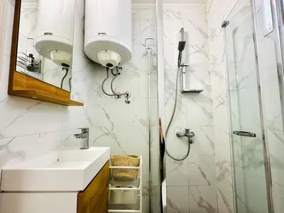 a bathroom with a sink and a shower at MorePlanina in Sutomore