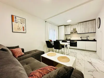 a living room with a couch and a table at MorePlanina in Sutomore