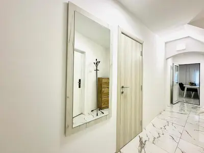 a mirror on the wall of a hallway at MorePlanina in Sutomore