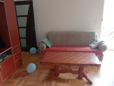 a living room with a couch and a table at Vila Teodora in Budva