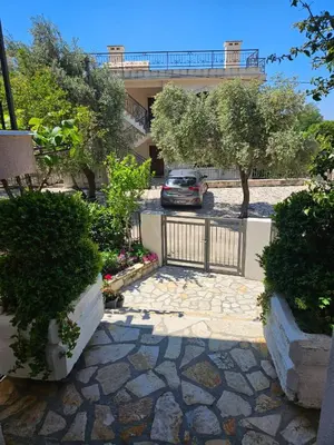 a car parked in a parking lot in front of a building at Vila Lučica apartman 2 pogled planina in Petrovac na Moru
