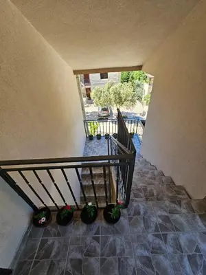 an overhead view of a staircase with potted plants at Vila Lučica apartman pogled na more in Petrovac na Moru